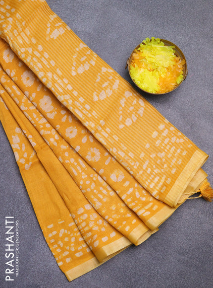 Pure linen saree yellow with allover batik prints and silver zari woven border