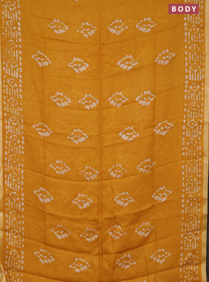 Pure linen saree yellow with allover batik prints and silver zari woven border