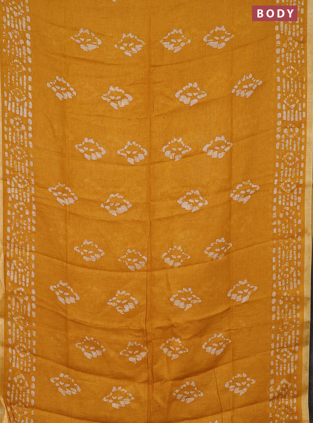 Pure linen saree yellow with allover batik prints and silver zari woven border