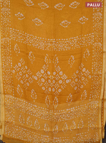 Pure linen saree yellow with allover batik prints and silver zari woven border