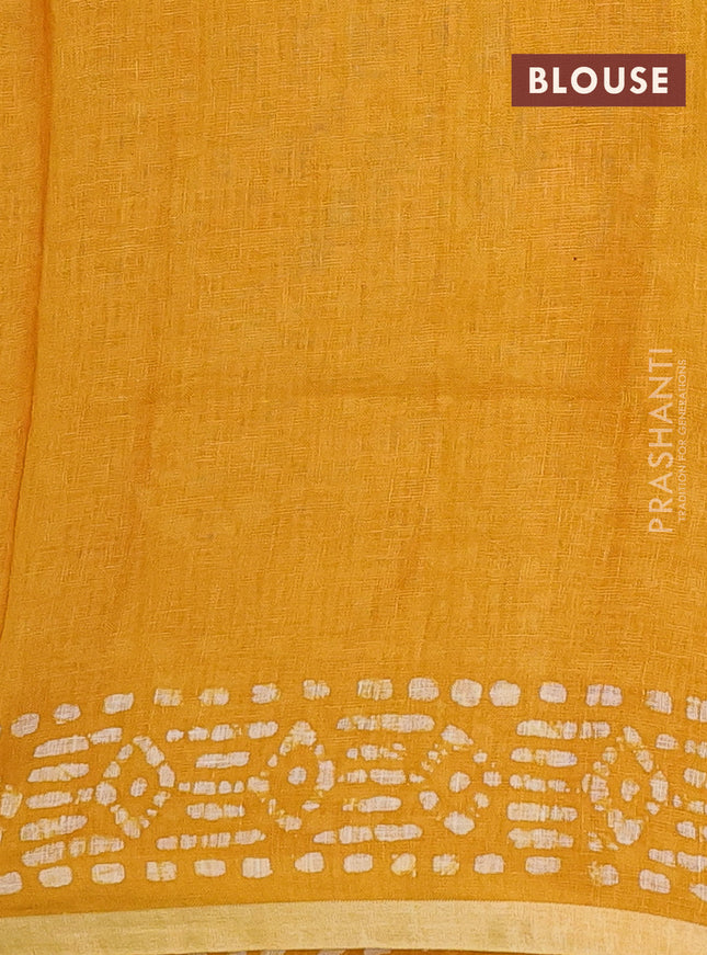Pure linen saree yellow with allover batik prints and silver zari woven border