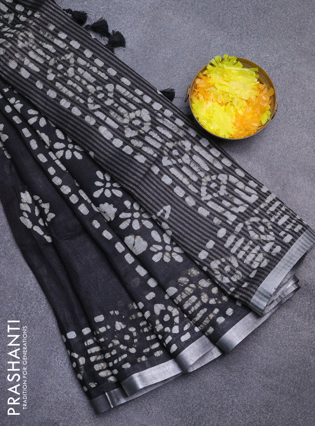 Pure linen saree black with allover batik prints and silver zari woven border