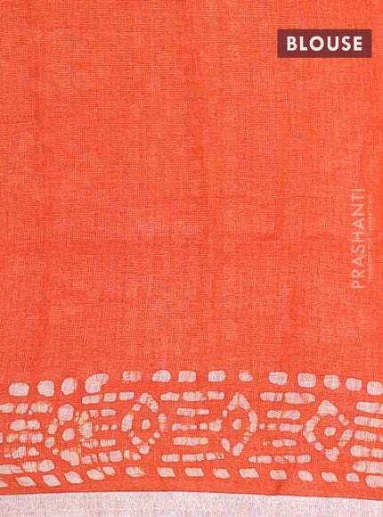 Pure linen saree orange with allover batik prints and silver zari woven border