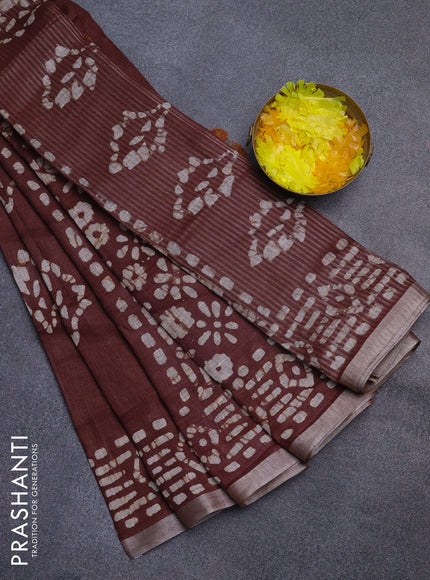 Pure linen saree brown with allover batik prints and silver zari woven border