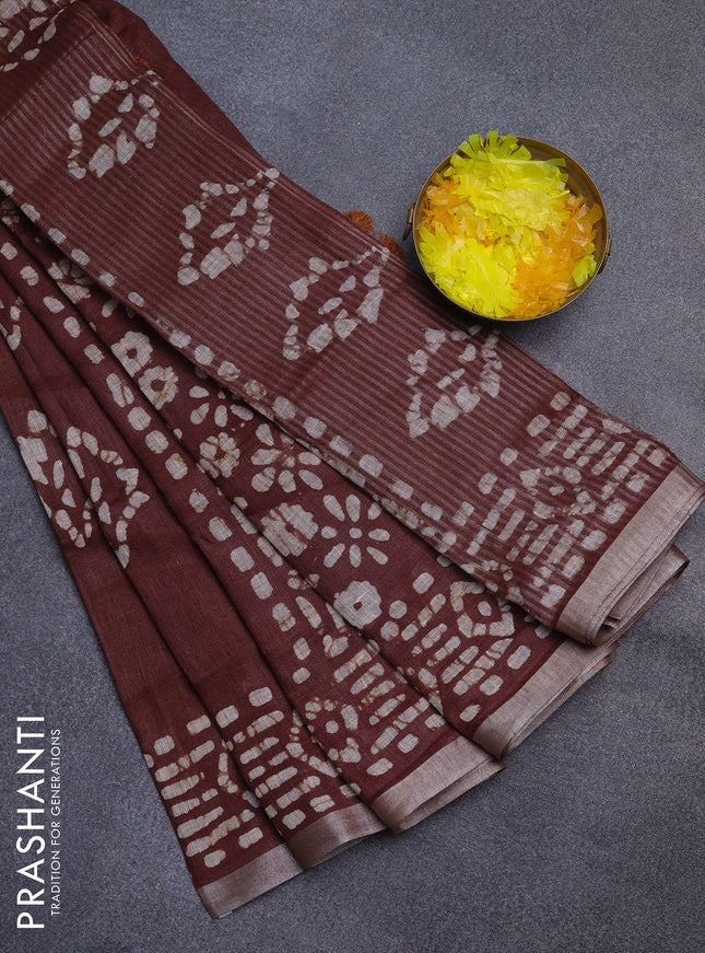 Pure linen saree brown with allover batik prints and silver zari woven border