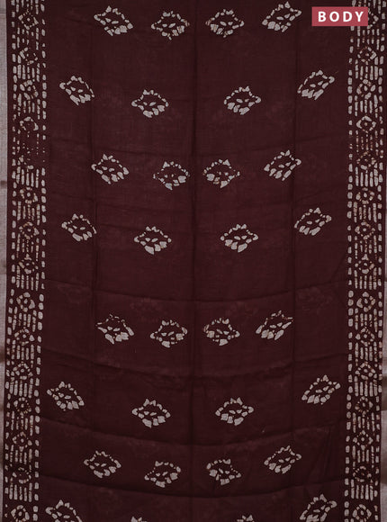 Pure linen saree brown with allover batik prints and silver zari woven border