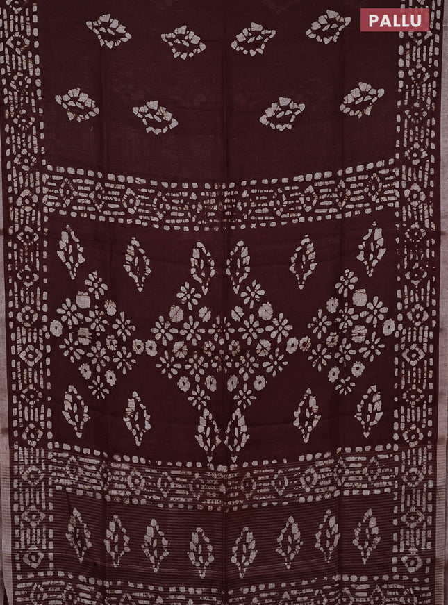 Pure linen saree brown with allover batik prints and silver zari woven border
