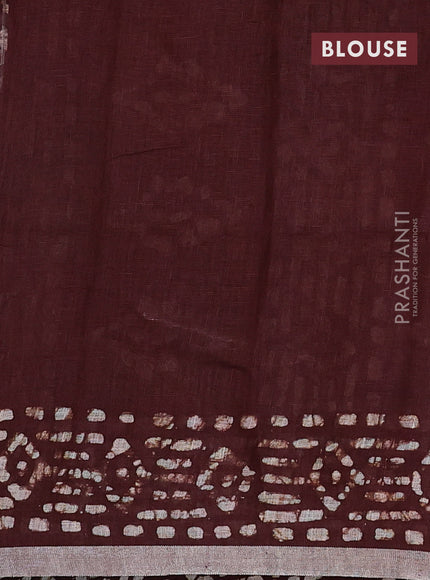 Pure linen saree brown with allover batik prints and silver zari woven border