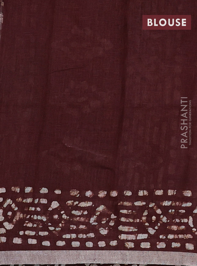 Pure linen saree brown with allover batik prints and silver zari woven border