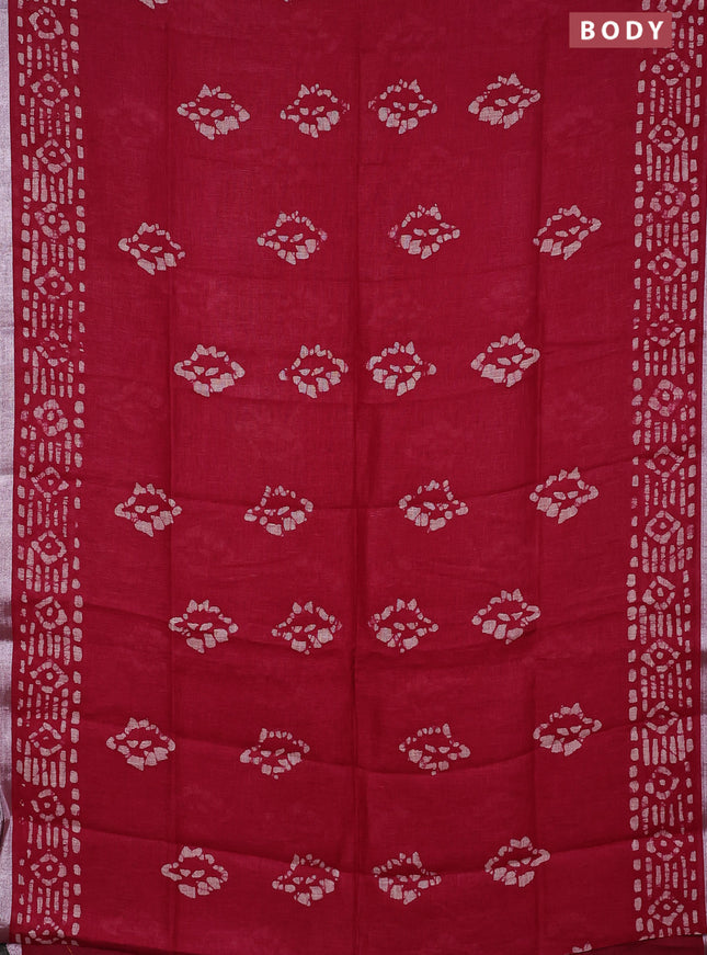 Pure linen saree dark pink with allover batik prints and silver zari woven border