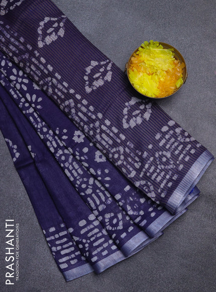 Pure linen saree navy blue with allover batik prints and silver zari woven border