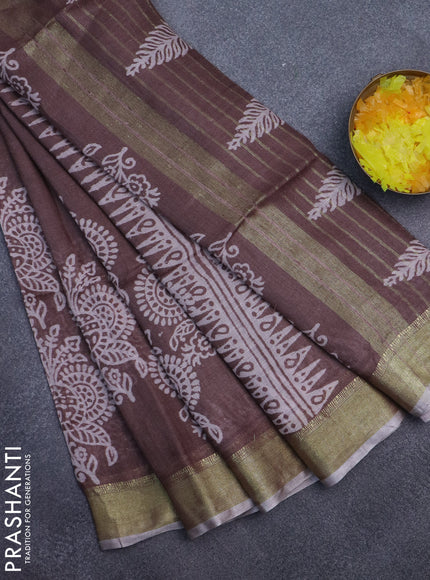 Pure linen saree pastel brown with allover prints and zari woven border
