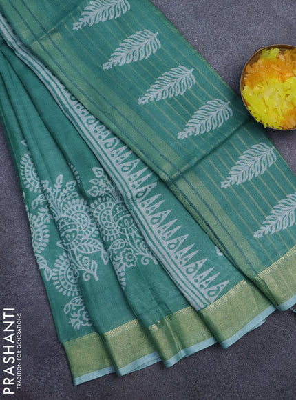Pure linen saree teal green with allover prints and zari woven border