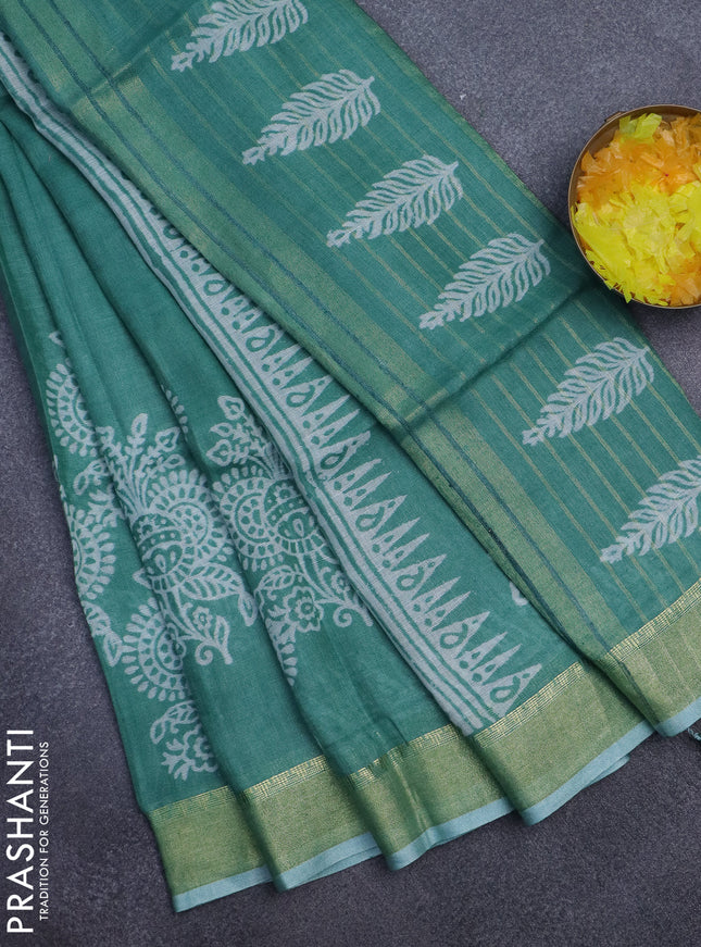 Pure linen saree teal green with allover prints and zari woven border