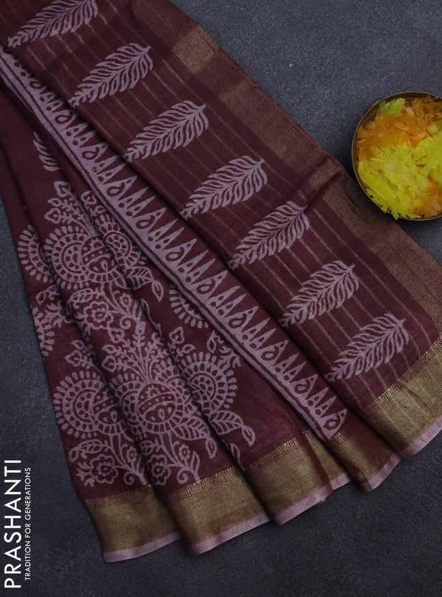 Pure linen saree pastel maroon with allover prints and zari woven border