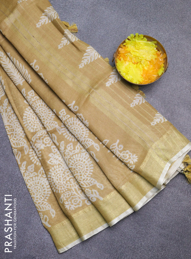 Pure linen saree sandal with allover prints and zari woven border