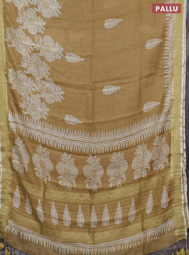 Pure linen saree sandal with allover prints and zari woven border