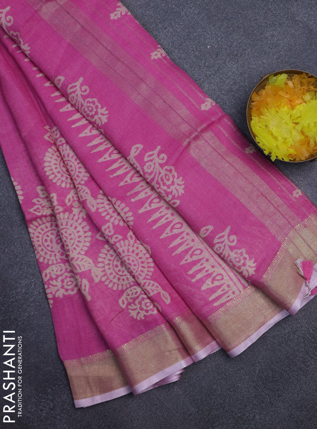 Pure linen saree light pink with allover prints and zari woven border
