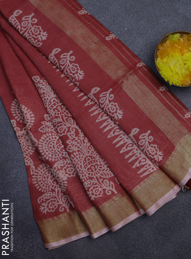 Pure linen saree pastel maroon with allover prints and zari woven border