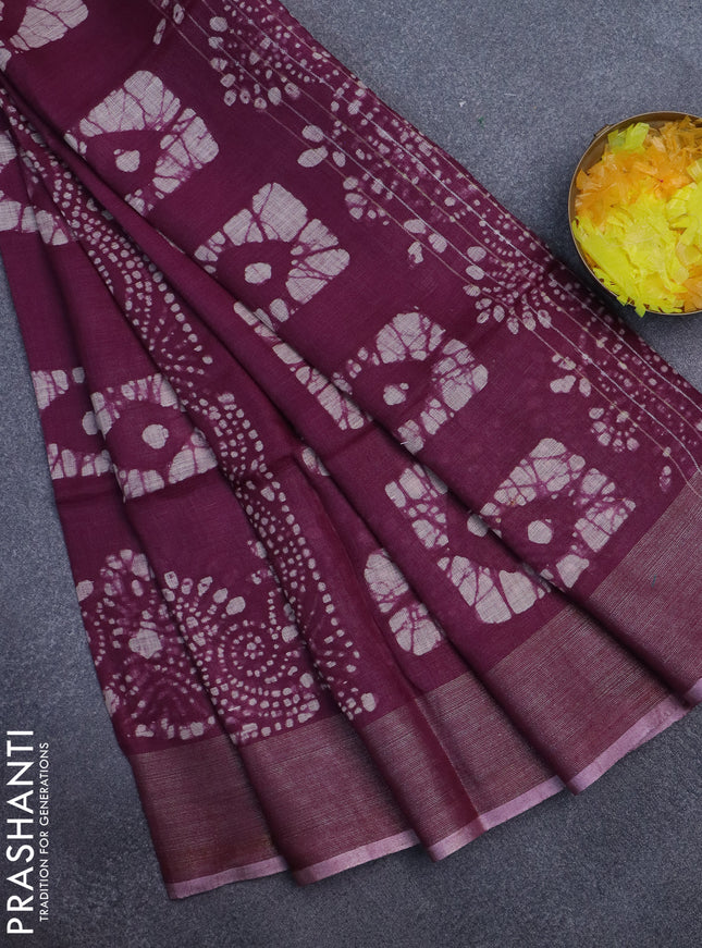 Pure linen saree wine shade with allover batik prints and zari woven border