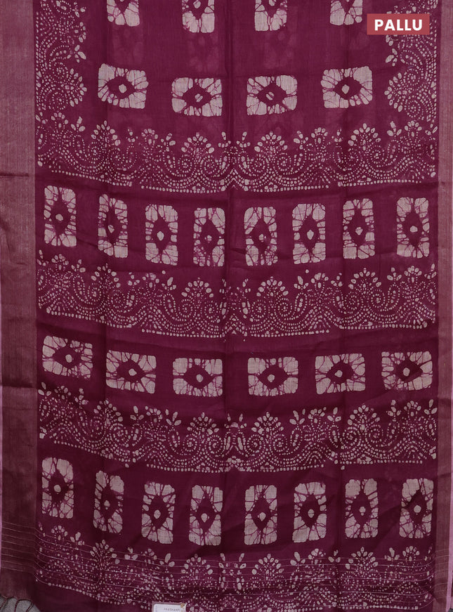 Pure linen saree wine shade with allover batik prints and zari woven border