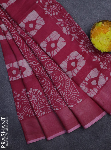 Pure linen saree dark pink with allover batik prints and zari woven border