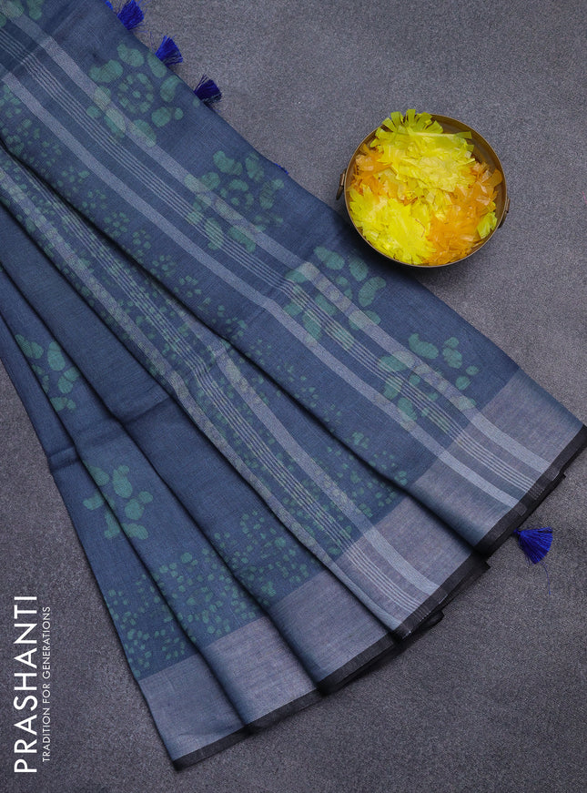 Pure linen saree bluish grey and black with allover batik prints and silver zari woven border