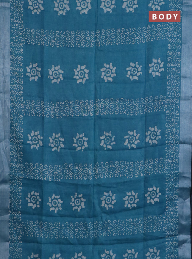Pure linen saree teal blue shade and black with allover batik prints and silver zari woven border