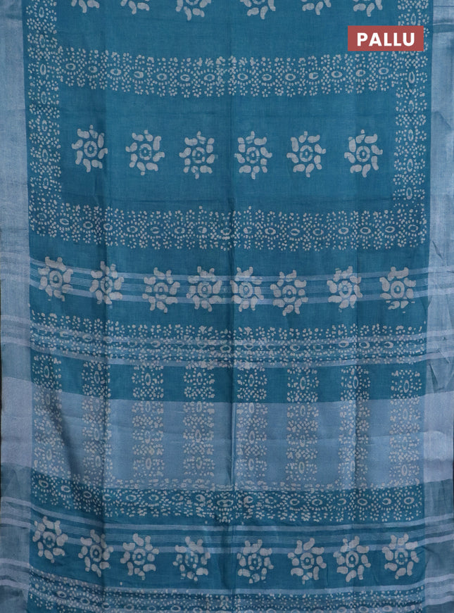 Pure linen saree teal blue shade and black with allover batik prints and silver zari woven border