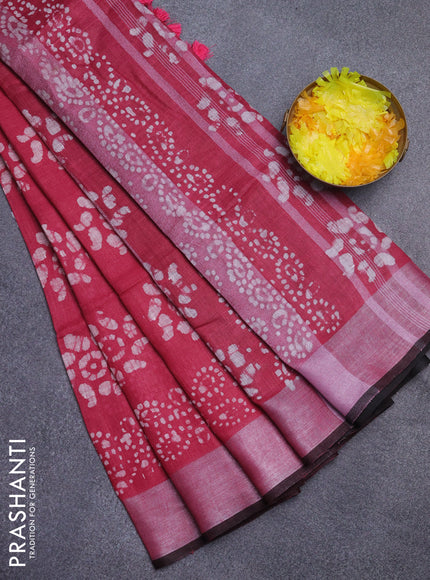 Pure linen saree pink and black with allover batik prints and silver zari woven border