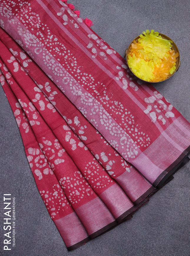 Pure linen saree pink and black with allover batik prints and silver zari woven border