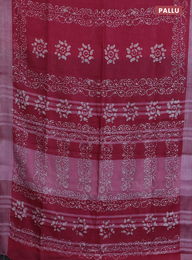 Pure linen saree pink and black with allover batik prints and silver zari woven border