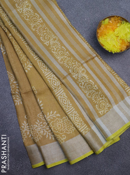 Pure linen saree dark sandal with allover prints and silver zari woven border