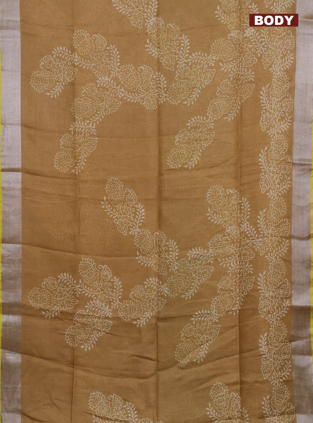 Pure linen saree dark sandal with allover prints and silver zari woven border