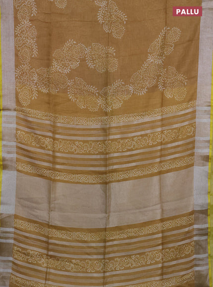 Pure linen saree dark sandal with allover prints and silver zari woven border