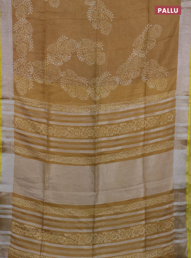 Pure linen saree dark sandal with allover prints and silver zari woven border