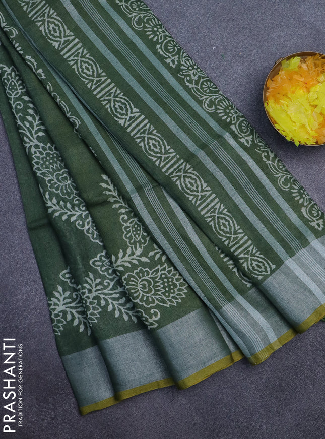 Pure linen saree green and yellow with allover prints and silver zari woven border