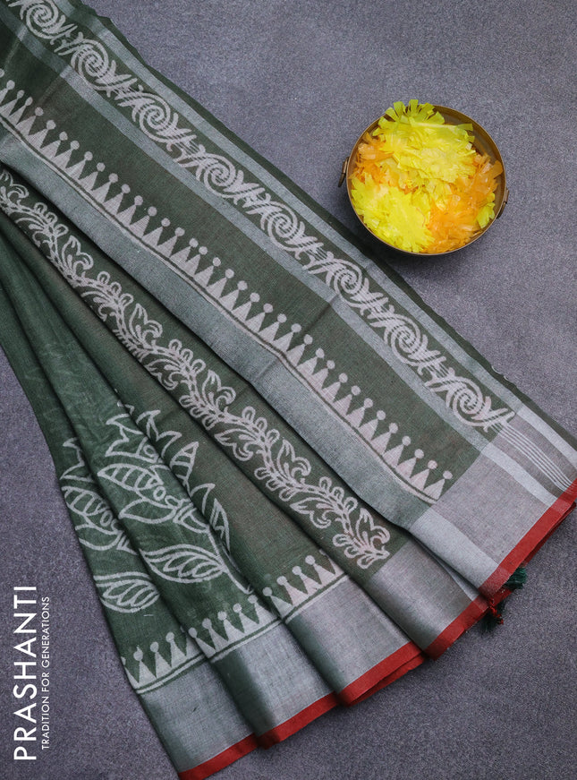 Pure linen saree sap green and red with batik butta prints and silver zari woven border