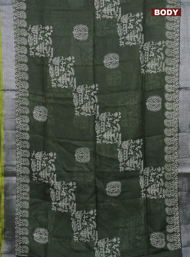 Pure linen saree sap green and yellow with allover prints and silver zari woven border