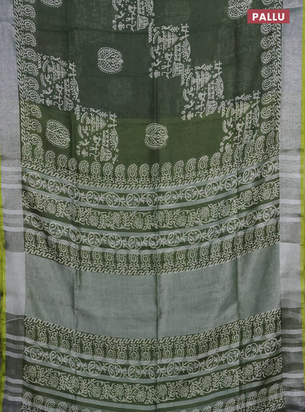Pure linen saree sap green and yellow with allover prints and silver zari woven border