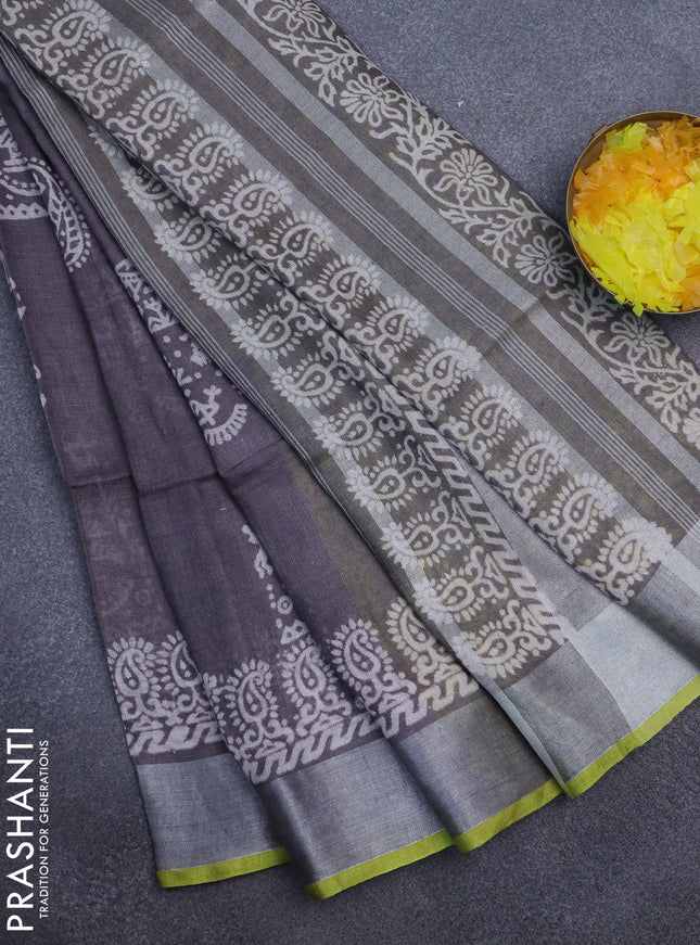 Pure linen saree greyish brown and yellow with allover prints and silver zari woven border