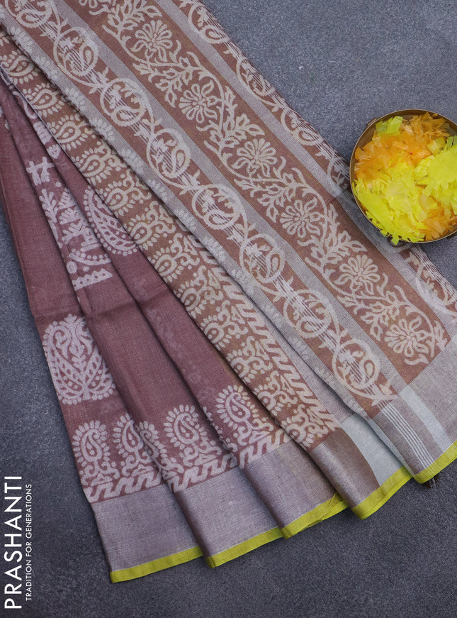 Pure linen saree pastel brown with allover prints and silver zari woven border