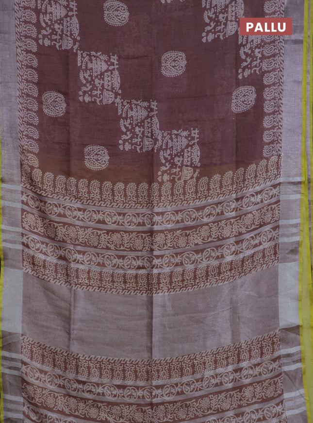 Pure linen saree pastel brown with allover prints and silver zari woven border