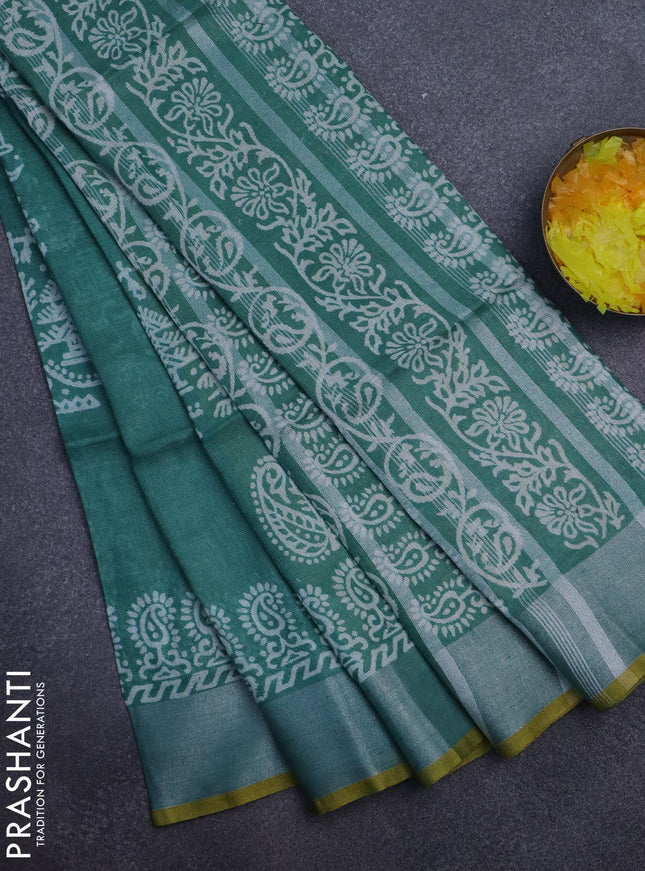 Pure linen saree green with allover prints and silver zari woven border
