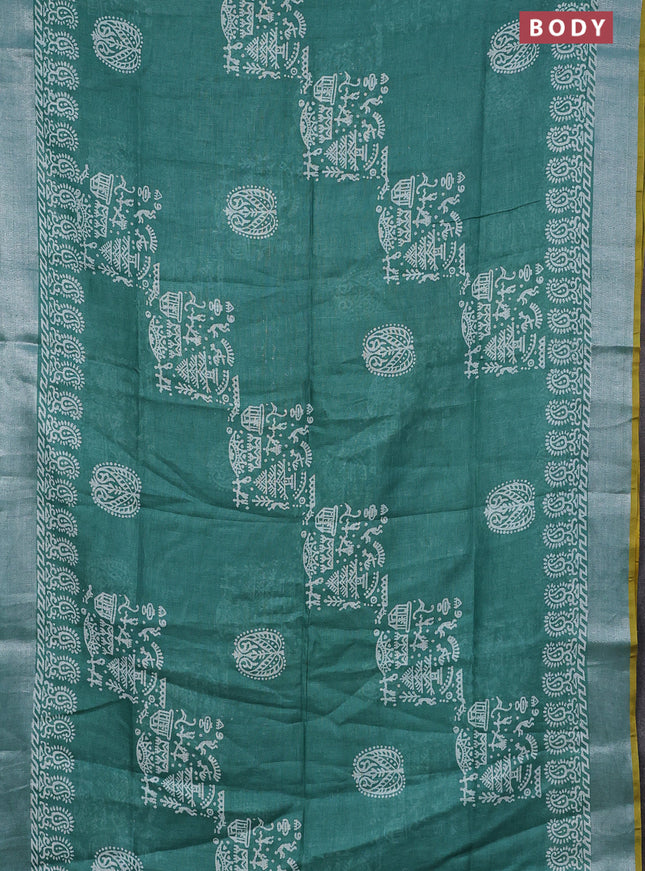 Pure linen saree green with allover prints and silver zari woven border
