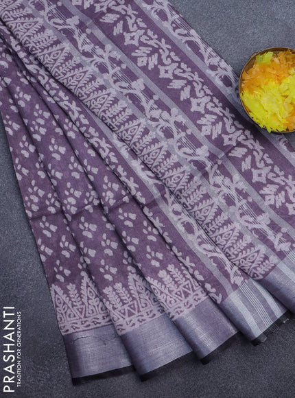 Pure linen saree pastel wine shade with allover prints and silver zari woven border
