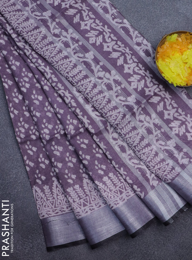 Pure linen saree pastel wine shade with allover prints and silver zari woven border