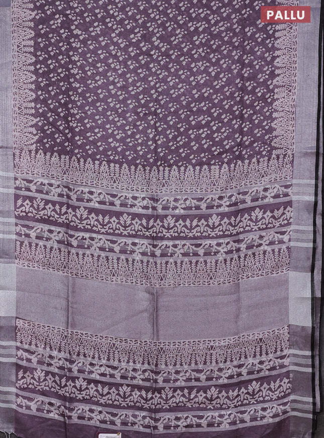 Pure linen saree pastel wine shade with allover prints and silver zari woven border