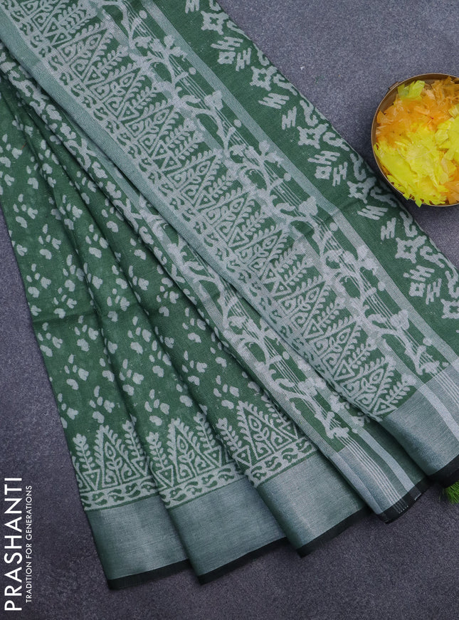 Pure linen saree green with allover prints and silver zari woven border