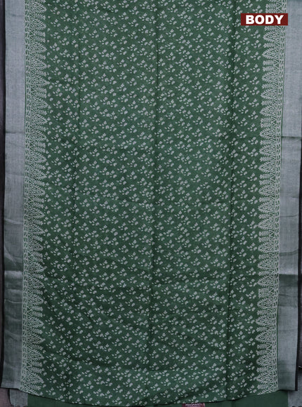 Pure linen saree green with allover prints and silver zari woven border